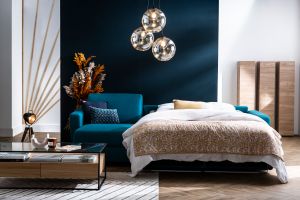 Canapé d'angle convertible réversible avec coffre 4 places en tissu bleu canard et bois clair GRAHAM