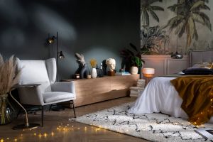 Fauteuil design en tissu effet velours texturé vert et métal noir COME