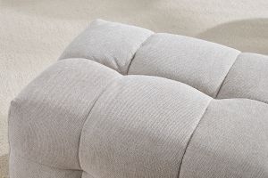 Pouf repose-pieds design en tissu effet velours texturé beige CORTO